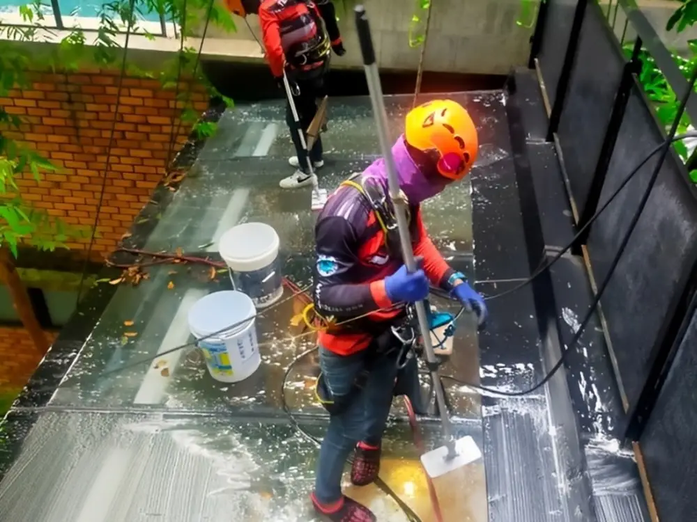 High-rise signboard cleaning using rope access