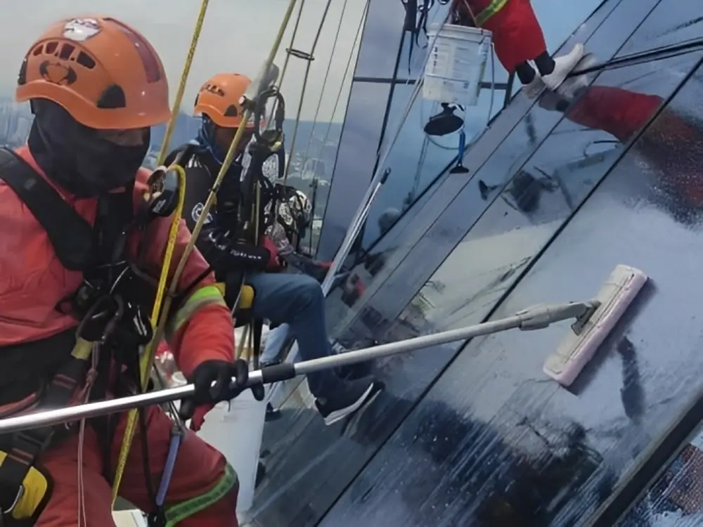 External high-rise window cleaning technicians